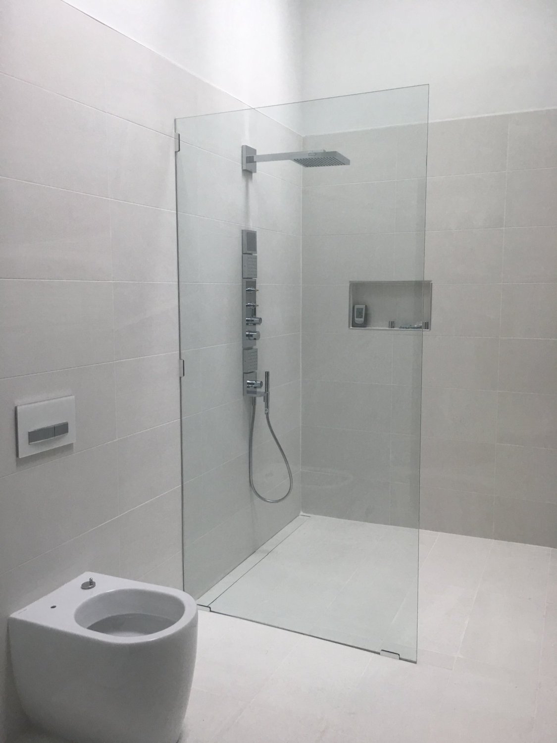 Frameless glass shower in rustic bathroom with wood beam ceiling, ClearVu Glass