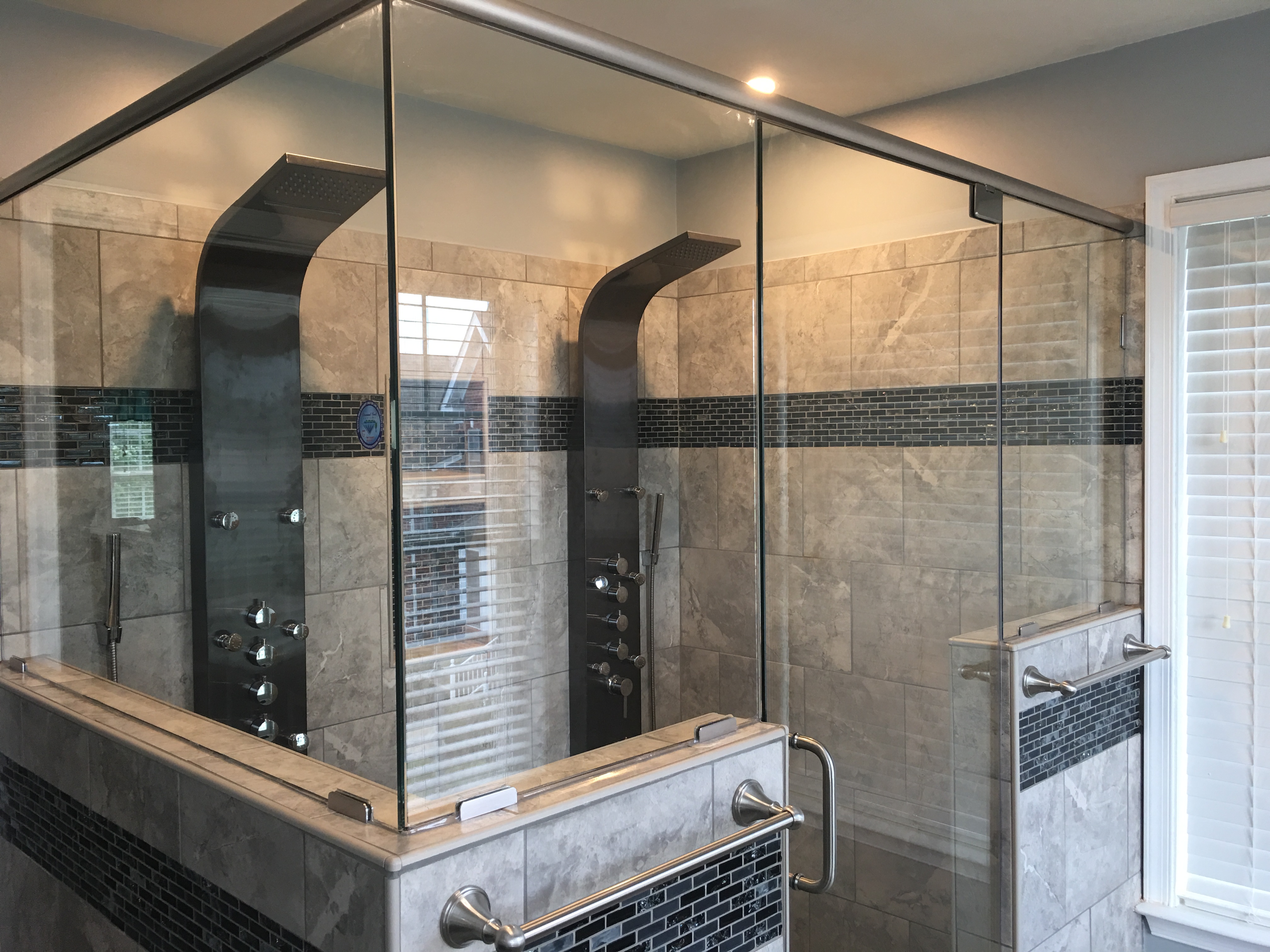 Large open-concept frameless shower enclosure with dual rain heads, ClearVu Glass Virginia